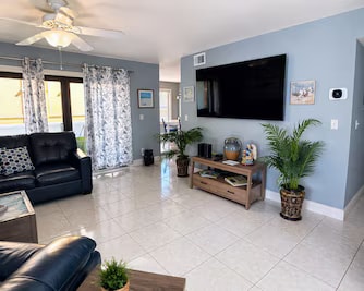Unit 204 living room with mounted TV